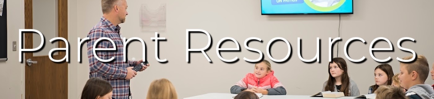 man teaching a group of children